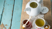 A refreshing cup of green tea, rich in antioxidants, served in a traditional teacup.